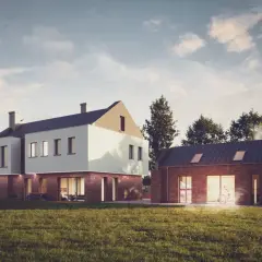 Nowoczesne domy z cegły i białego tynku na tle nieba i drzew.